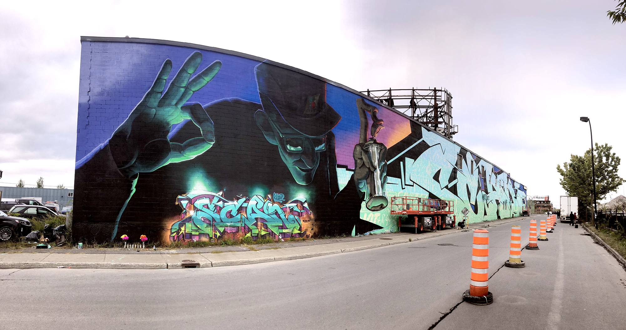 Large-scale exterior mural with depth and lighting effects by Harry Bones